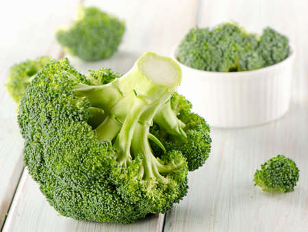 Broccoli on a wooden table. Selective focusの写真素材