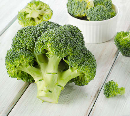 Broccoli on a wooden table. Selective focusの写真素材