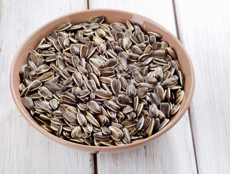 Sunflower seeds in a  bowl . Selective focusの写真素材