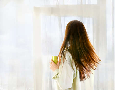 woman drinking tea in the morning at home