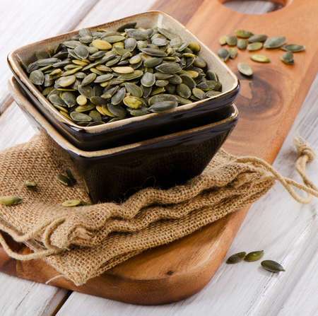 Pumpkin seeds  in a clay bowl.の写真素材