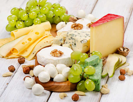 various types of  Cheese with on a wooden table. Selective focusの写真素材