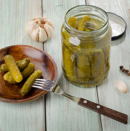 pickled cucumbers on a plate and  in  glass jar . Selective focusの写真素材