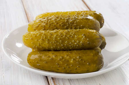pickled cucumbers on a white plate . Selective focusの写真素材