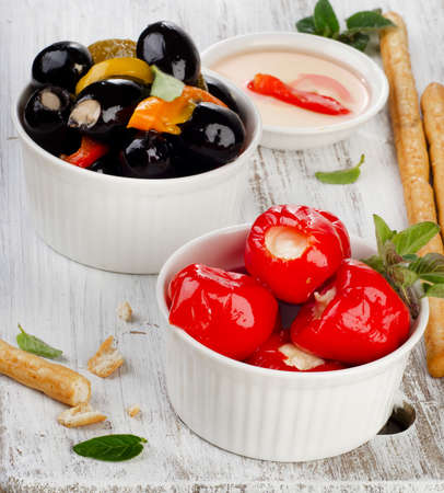 Olives and peppers filed with  cheese. Selective focusの写真素材