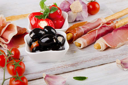 italian appetizer - Mixed Antipasto on a wooden table . Selective focusの写真素材