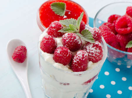 Dessert with raspberries and mint leaf. Selective focusの写真素材