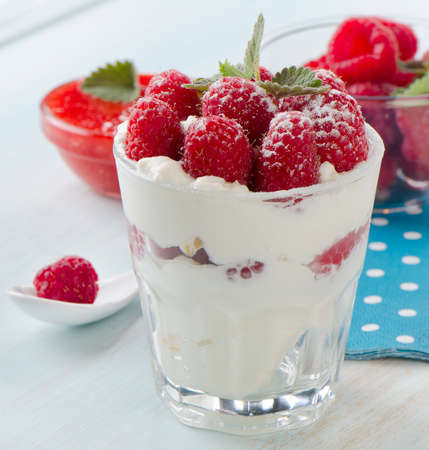Dessert with raspberries and mint leaf. Selective focusの写真素材
