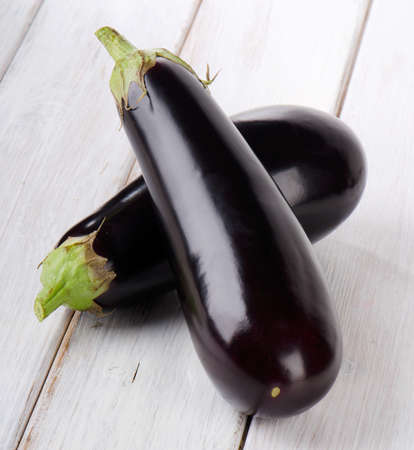 Two eggplants  on a wooden table. Selective focusの写真素材