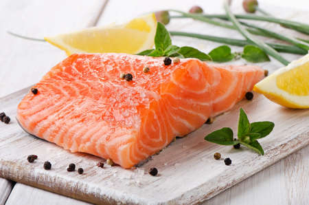 Salmon on a wooden board . Selective focusの写真素材
