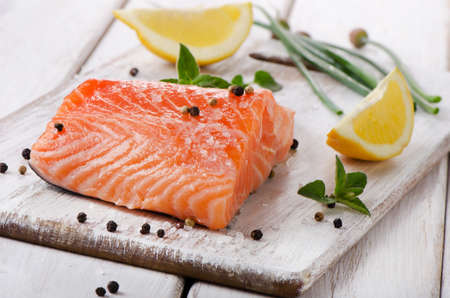 Salmon on a wooden board . Selective focusの写真素材