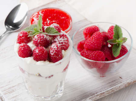 Dessert with raspberries and mint leaf. Selective focusの写真素材
