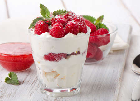 Dessert with raspberries and mint leaf. Selective focusの写真素材
