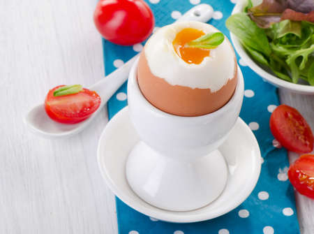Soft boiled egg with toast and herb - healthy breakfast. Selective focusの写真素材