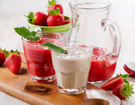 Berry smoothie with fresh berries on a wooden table . Selective focusの写真素材