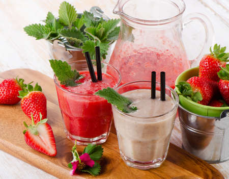 Berry smoothie with fresh berries on a wooden table . Selective focusの写真素材
