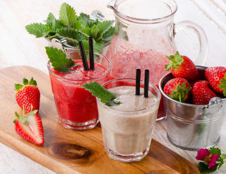 Berry smoothie with fresh berries on a wooden table . Selective focusの写真素材
