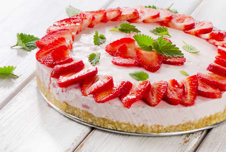 Cheese cake with fresh berries  on wooden table. Selective focusの写真素材