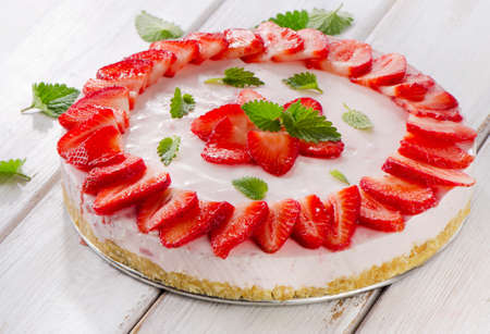 Cheese cake with fresh berries  on wooden table. Selective focusの写真素材