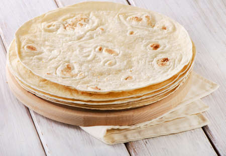 Wheat Flour Tortillas on wooden board. Selective focusの写真素材