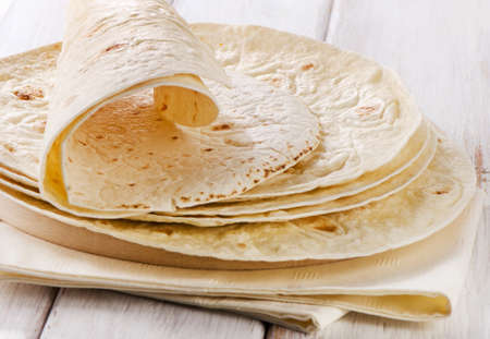 Wheat Flour Tortillas on wooden board. Selective focusの写真素材