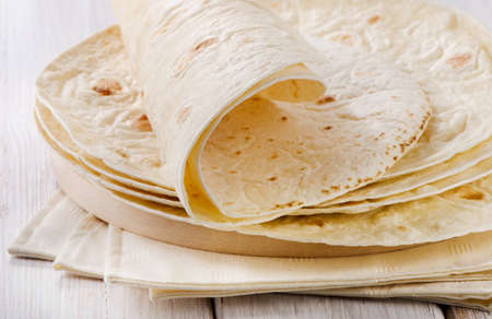 Wheat Flour Tortillas on wooden board. Selective focusの写真素材