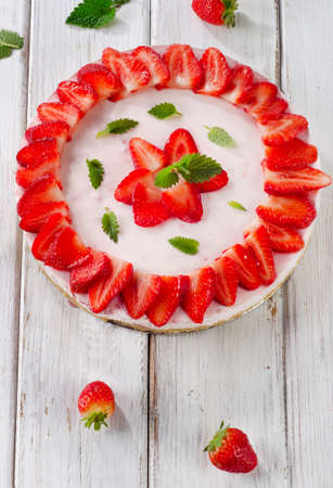 Cheese cake with fresh berries  on wooden table. Selective focus の写真素材