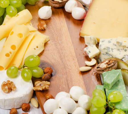 various types of  Cheese with nuts and fruits. Selective focusの写真素材
