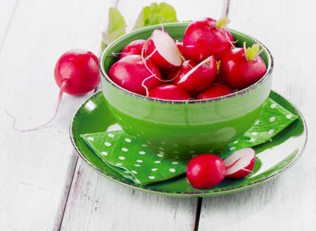 fresh radish in a blue plate. Selective focusの写真素材