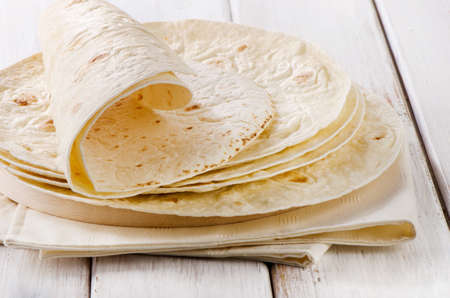 Wheat Flour Tortillas on wooden board. Selective focusの写真素材