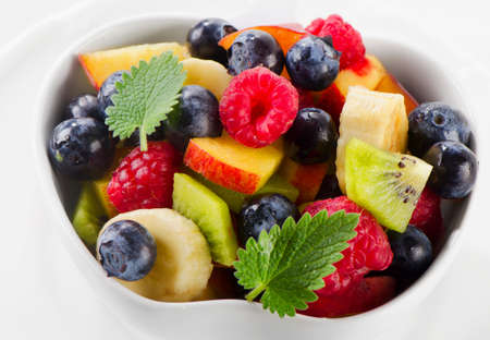 Fresh healthy fruit salad with mint leaves. Selective focusの写真素材