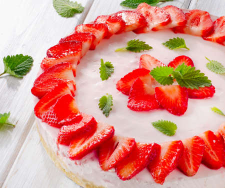 Cheese cake with fresh berries  on wooden table. Selective focusの写真素材