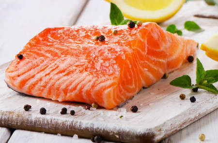 Salmon on a wooden board . Selective focusの写真素材