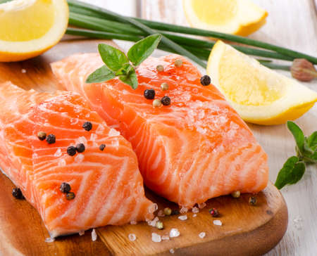 Salmon on a wooden board . Selective focusの写真素材