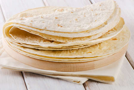 Wheat Flour Tortillas on wooden board. Selective focusの写真素材