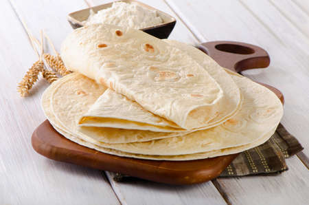 Wheat Flour Tortillas on wooden board. Selective focusの写真素材