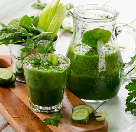 Healthy green smoothie on a wooden table. Selective focusの写真素材