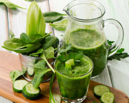 Healthy green smoothie on a wooden table. Selective focusの写真素材