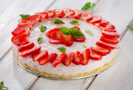 Cheese cake with fresh berries  on wooden table. Selective focusの写真素材