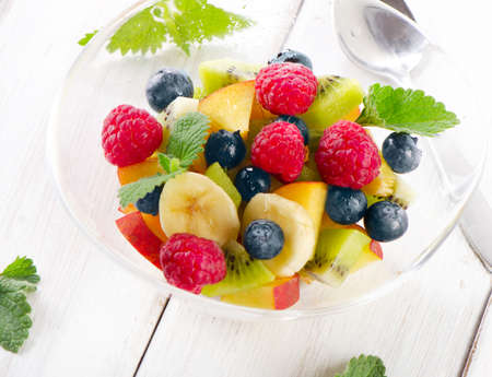 Fresh healthy fruit salad with mint leaves. Selective focusの写真素材