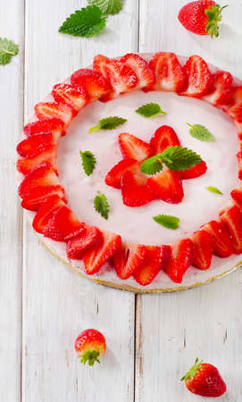 Cheese cake with fresh berries  on wooden table. Selective focusの写真素材