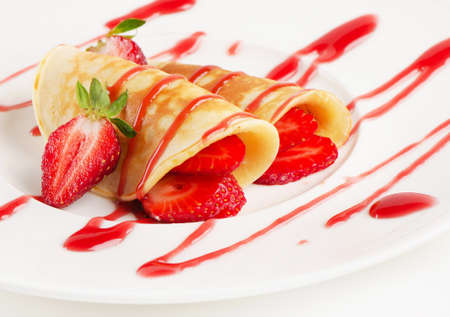 Sweet crepes with fresh strawberriesの写真素材