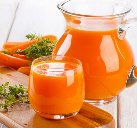 Carrot juice with fresh herbsの写真素材