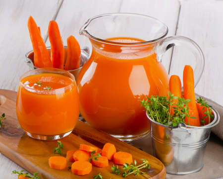 Carrot juice with fresh herbsの写真素材