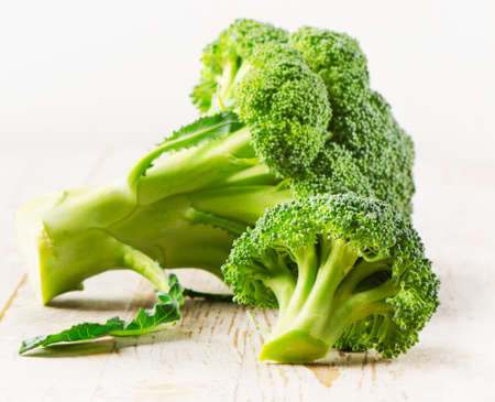broccoli on a wooden tableの写真素材