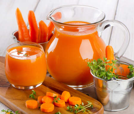 Carrot juice with fresh herbsの写真素材