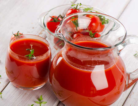 Tomato juice with fresh herbsの写真素材