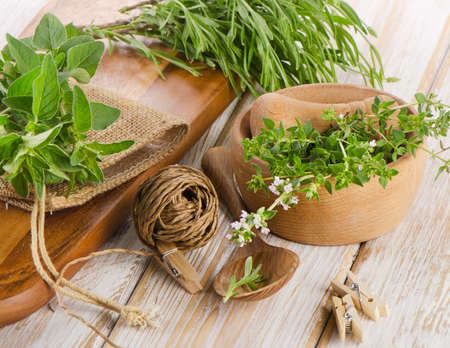 Various fresh herbs on a wooden table . Selective focusの写真素材