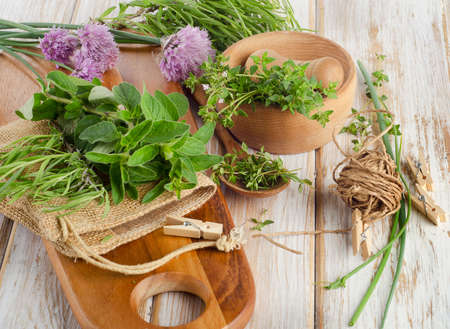 Various fresh herbs on a wooden table . Selective focusの写真素材