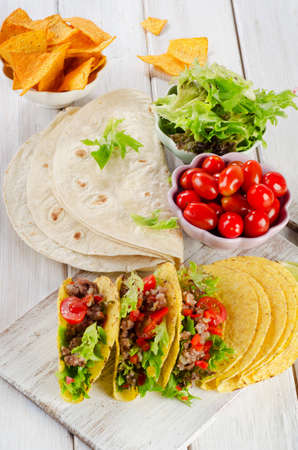Mexican tacos on a wooden table. Selective focusの写真素材